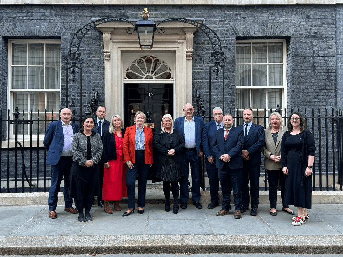 MU General Secretary Naomi Pohl standing in front of Number 10 Downing Street, along with general secretaries from unions across the country.